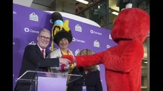 Starmer celebrated his victory with Elmo and a man in a giant hat by his side during his victory speech.