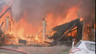 A huge fire ravages three houses in Brisbane, causing massive destruction.