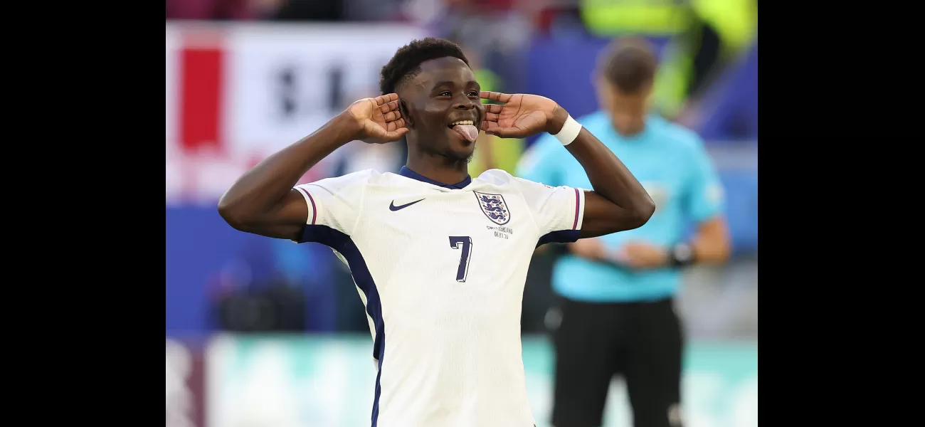 Sancho congratulates Saka after England's win against Switzerland in Euro 2024.