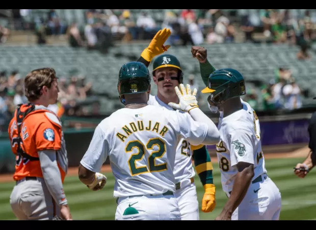 The Athletics dominated the Orioles with two 3-run homers from Rooker and Schuemann in a 19-8 victory.