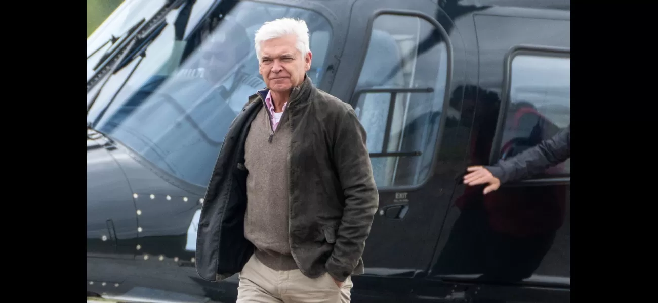 Phillip Schofield arrives at Silverstone for Grand Prix by helicopter in rare public outing.