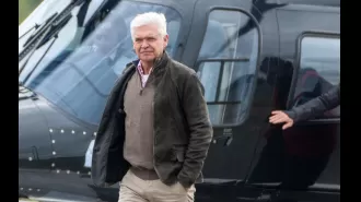 Phillip Schofield arrives at Silverstone for Grand Prix by helicopter in rare public outing.