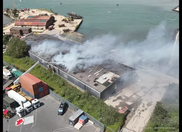 A massive fire has shut down a major highway, causing major disruptions for drivers.