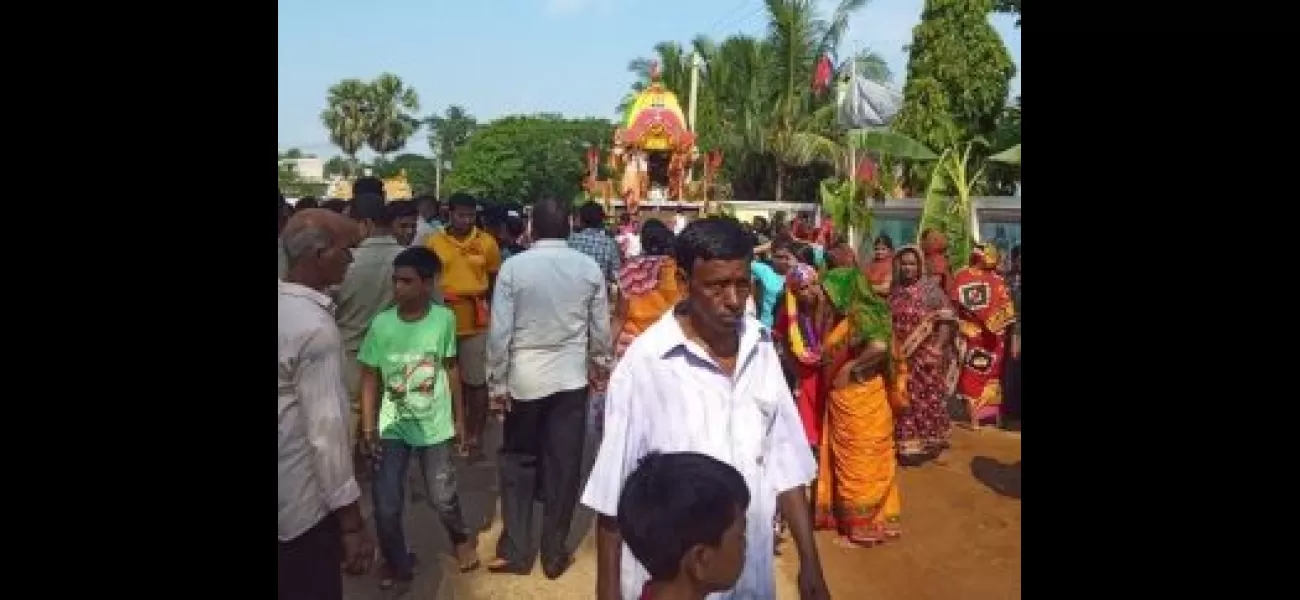 A police officer in Odisha's Dharmasala carries out the ceremonial ritual of sweeping Lord Jagannath's chariot.