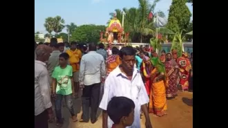 A police officer in Odisha's Dharmasala carries out the ceremonial ritual of sweeping Lord Jagannath's chariot.