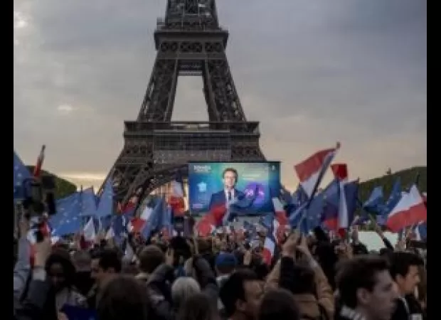 France is voting in an election with high turnout that could result in sharing power between Macron and the far right.