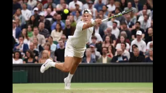 Holger Rune accidentally hits a ball boy during a match against Novak Djokovic at Wimbledon.