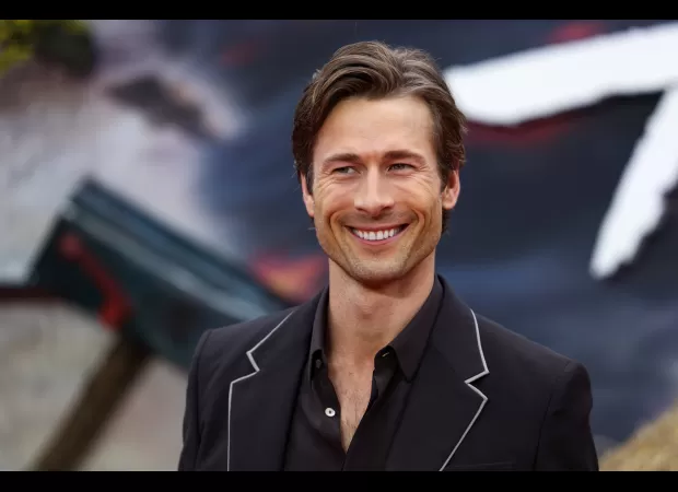 A famous actor uses his cute puppy to create the perfect seductive photo.