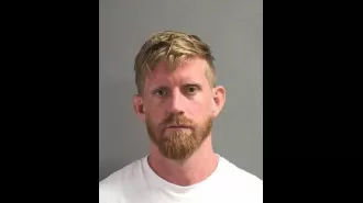 Man taken into custody for endangering child, letting them fall from balcony of hotel's second floor.