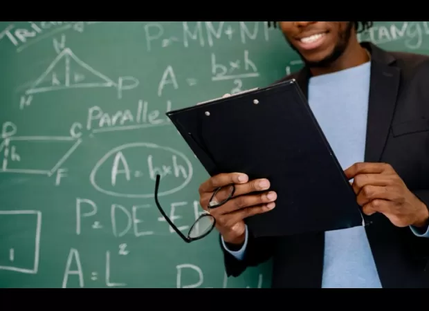 Baltimore teacher's job saved despite hair-braiding dispute with student.