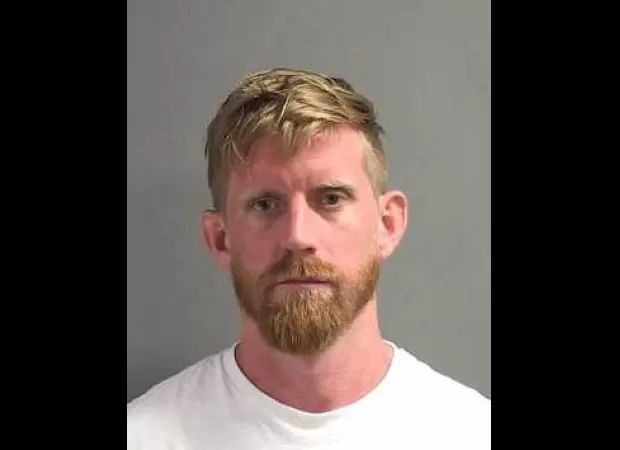 Man taken into custody for endangering child, letting them fall from balcony of hotel's second floor.