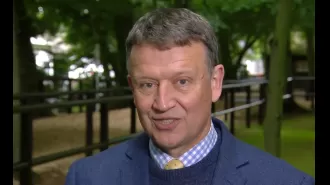 ITV presenter cries while honoring family of murdered colleague John Hunt during racing broadcast.
