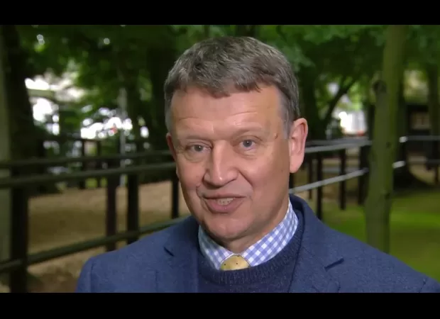 ITV presenter cries while honoring family of murdered colleague John Hunt during racing broadcast.