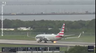 Aircraft's tire catches on fire and bursts while taking off.