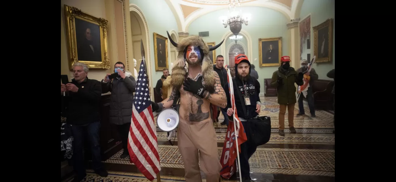 'QAnon Shaman' seeks return of iconic helmet and spear from Capitol incident.