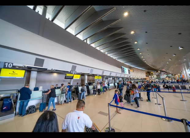 A man in Perth was fined for assaulting federal police during his arrest at the airport by kicking and attempting to headbutt them.