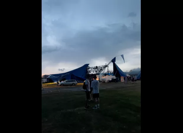 Festival cancelled due to safety concerns, 12 injured and evacuation underway.