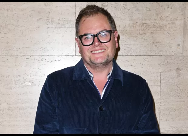 Peek into Alan Carr's personal life, including his father's fame as a soccer player.