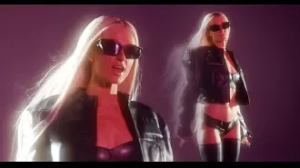 Paris Hilton is shown dancing in sexy black lingerie for her music video transformation.
