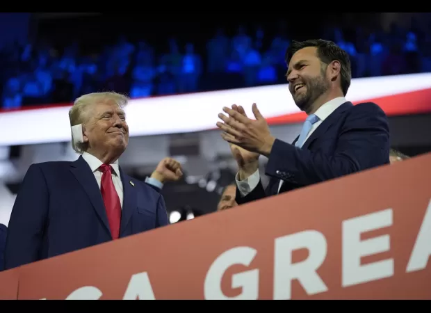 Trump receives enthusiastic welcome, smiles with bandages