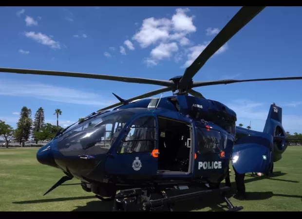 Man detained after police helicopter struck by laser beam