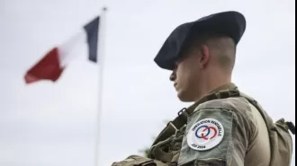 Possible paraphrase: Suspected Olympics terror plot leads to arrest of Neo-Nazi sympathizer.