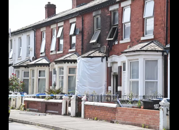 Two adults killed and two children injured in a house fire.