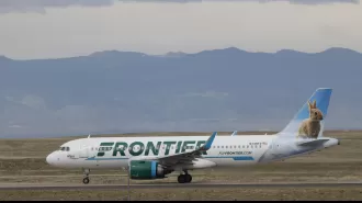 Denver International Airport experiences flight cancellations and delays due to an outage at Frontier Airlines.