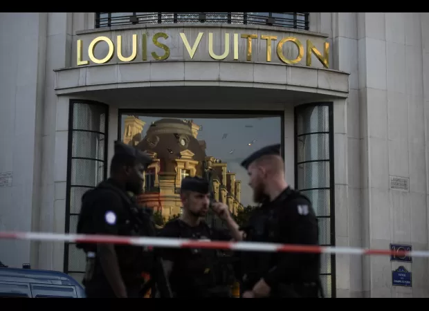 A police officer was stabbed and the attacker was killed in central Paris.