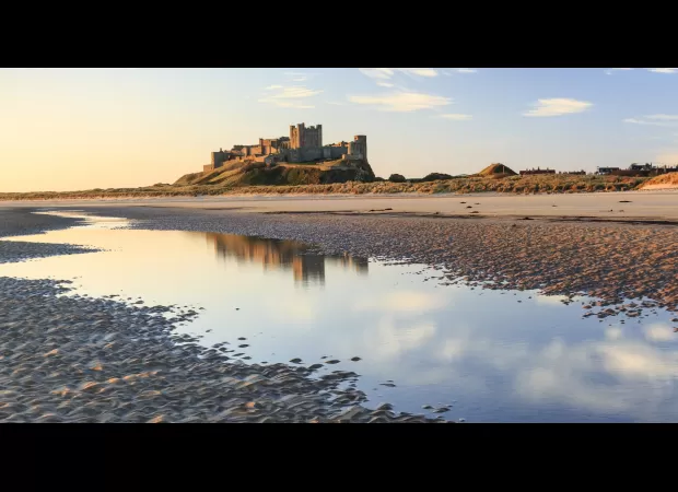 Bamburgh, a peaceful village, is considered the top seaside spot in the UK.