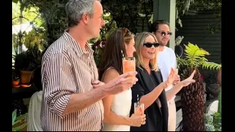 Margot Robbie treats everyone at restaurant to a drink and appears to confirm pregnancy.