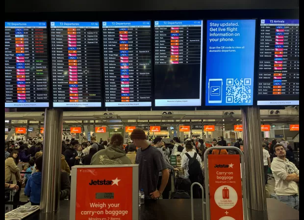 Australia travelers face flight delays as airlines and airports recover from worldwide IT system failure.