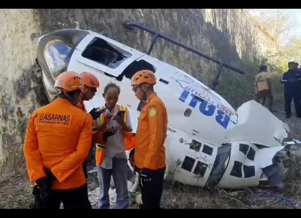 A helicopter crashes in Bali, but five people, including two Australians, manage to survive.