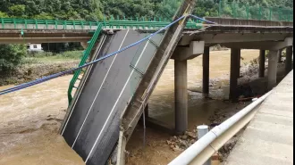 Flooding causes bridge collapse, leaving 11 dead and many missing.