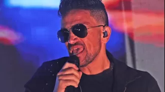 Peter Andre was taken off stage after getting too excited while reminiscing about his 90s fame.