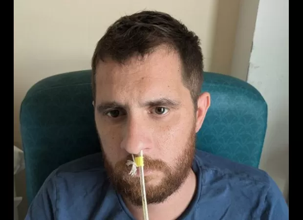 A father of two was left with mobility and speech impairments after contracting a bacterial stomach infection.