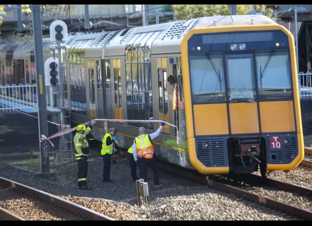A brave father tragically loses his life while attempting to rescue his twins from an oncoming train after their pram rolled onto the tracks.