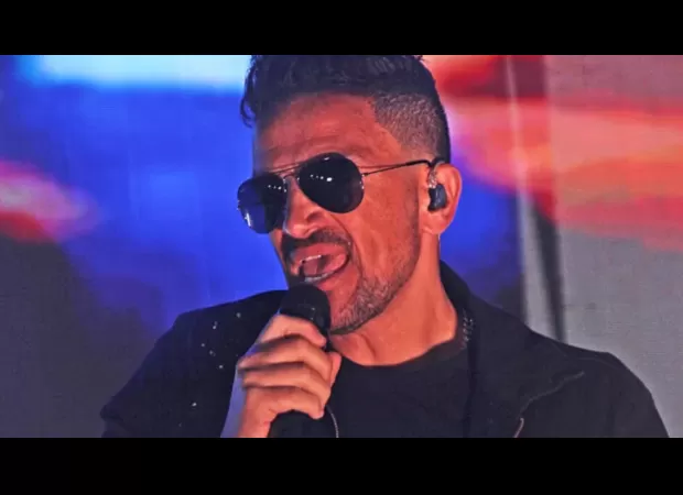 Peter Andre was taken off stage after getting too excited while reminiscing about his 90s fame.