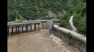 Fifteen people dead in China after bridge collapse caused by flash floods.