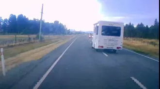 Video captures near-crash between campervan and car on dangerous New Zealand road using dashcam footage.