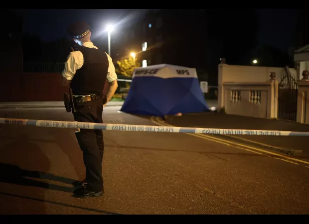 A 15-year-old boy was fatally stabbed near a school, and the attacker is currently at large.