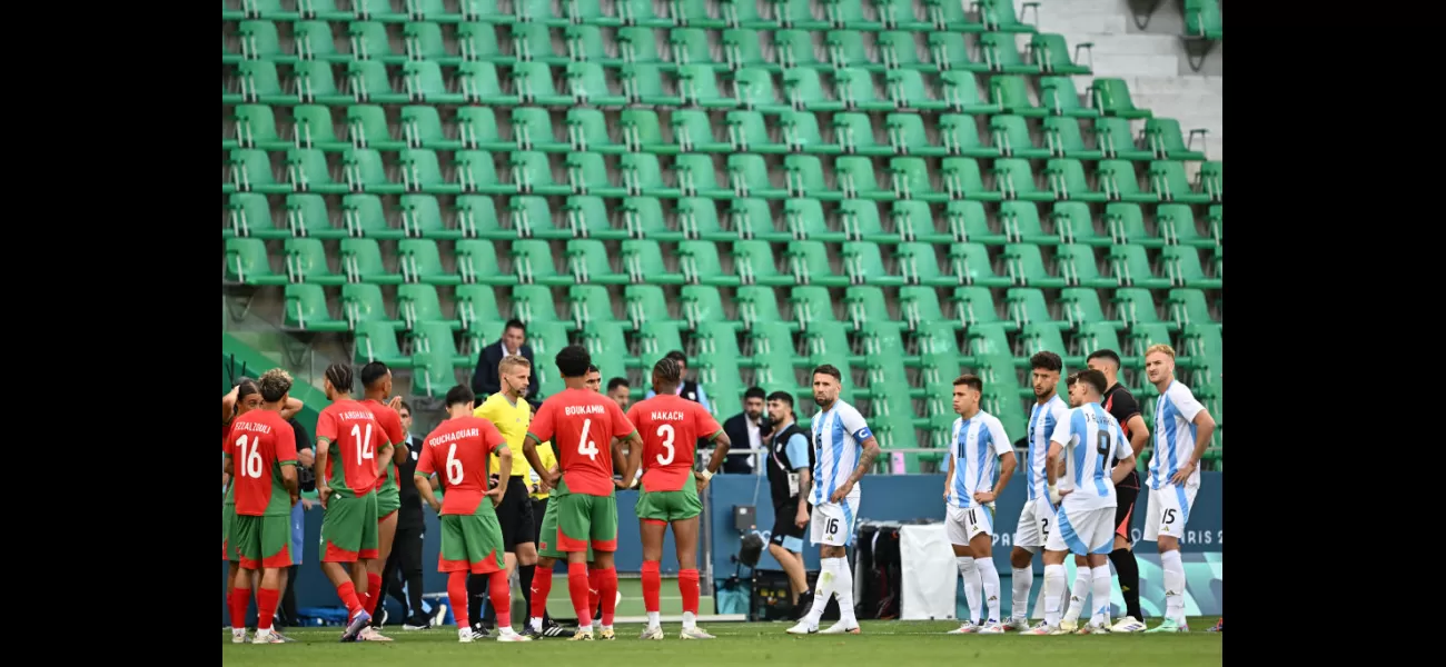 Fans removed from stadium during chaotic Olympics football game due to field intrusion.