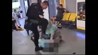 Police officer viciously attacks boy, brutally kicking him in face and stomping on his head as he lies defenseless on the ground.