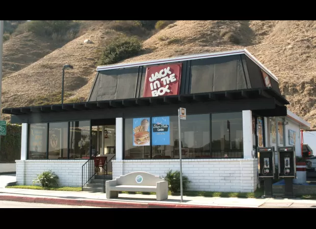 Customer drives over employee after not receiving chicken strip and sauce.