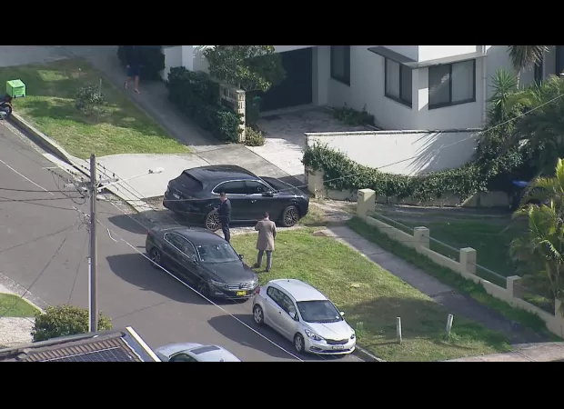 Two people fought police officers after reportedly being discovered with firearms on a street in Sydney.