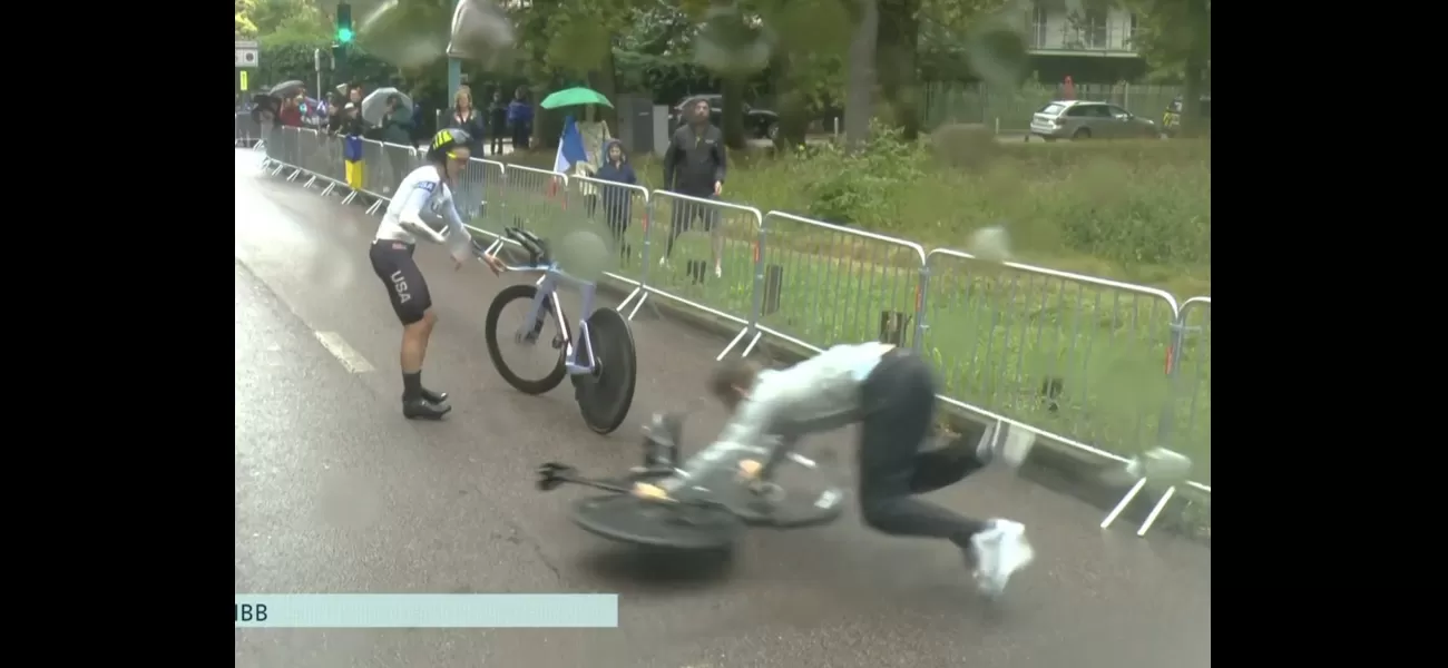A mechanic in the US falls during the rainy women's time trial at the Paris Olympics.