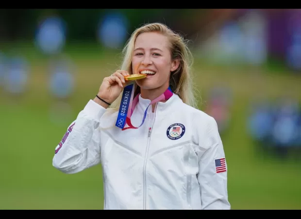 Athletes commonly bite their medals at the Olympics as a playful and symbolic gesture of victory and achievement.
