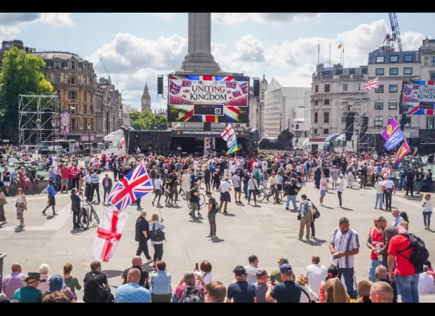 London protesters demand the return of their country at Tommy Robinson rally, drawing a large crowd.