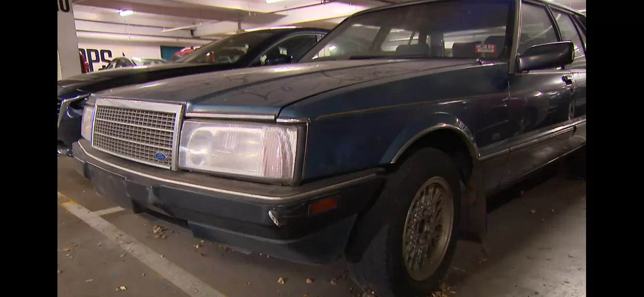 An unknown car has been left at a shopping center for more than ten years, with no explanation.