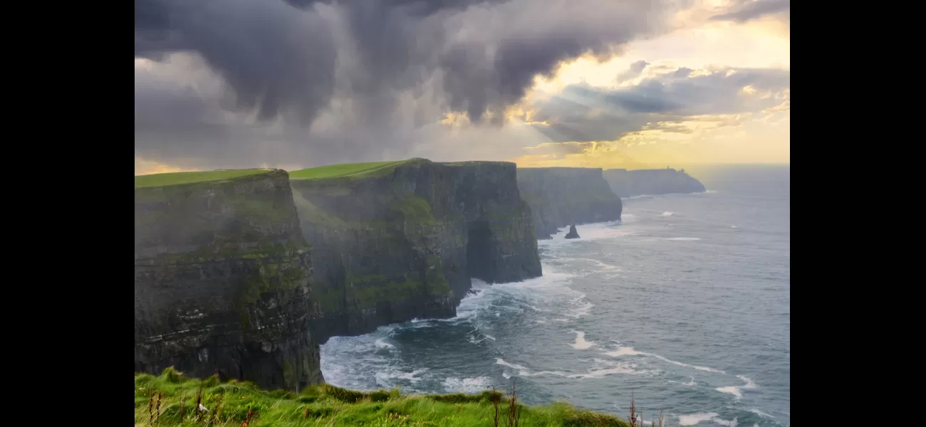 A body was found during the search for a 12-year-old boy who fell from a 702ft cliff into the water.